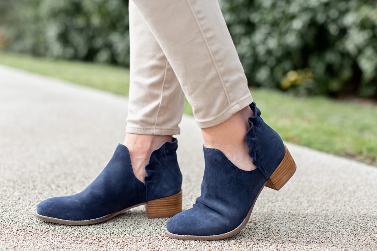 women's navy blue booties with ruffle on back