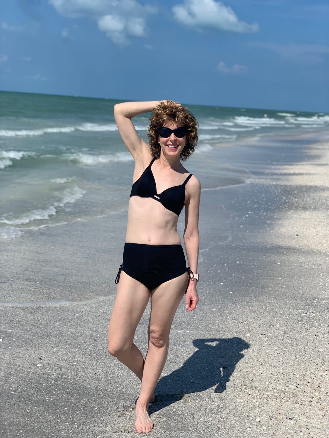 woman in bikini on sanibel island beach trip