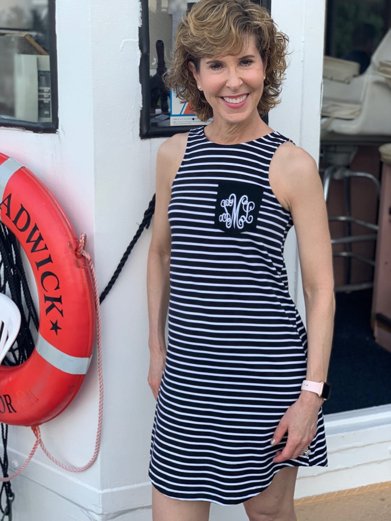 woman in black and white striped dress on the captiva cruises lady chadwick
