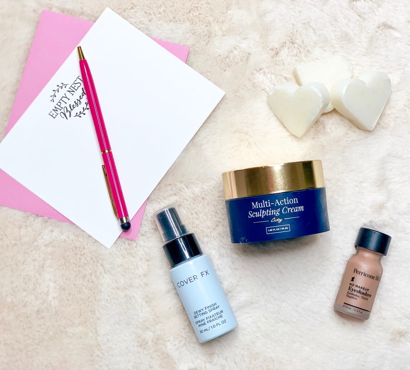 three beauty products, heart soap, and empty nest blessed stationery