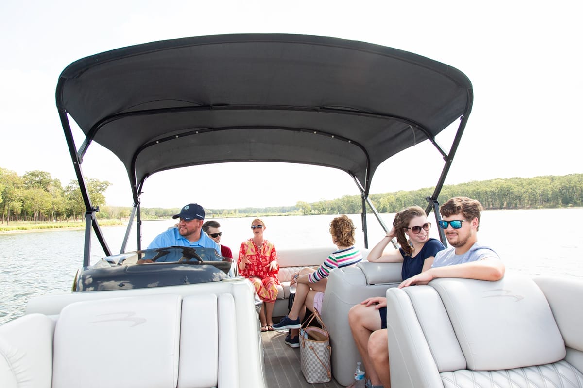 six adults on a boat ride at long cover