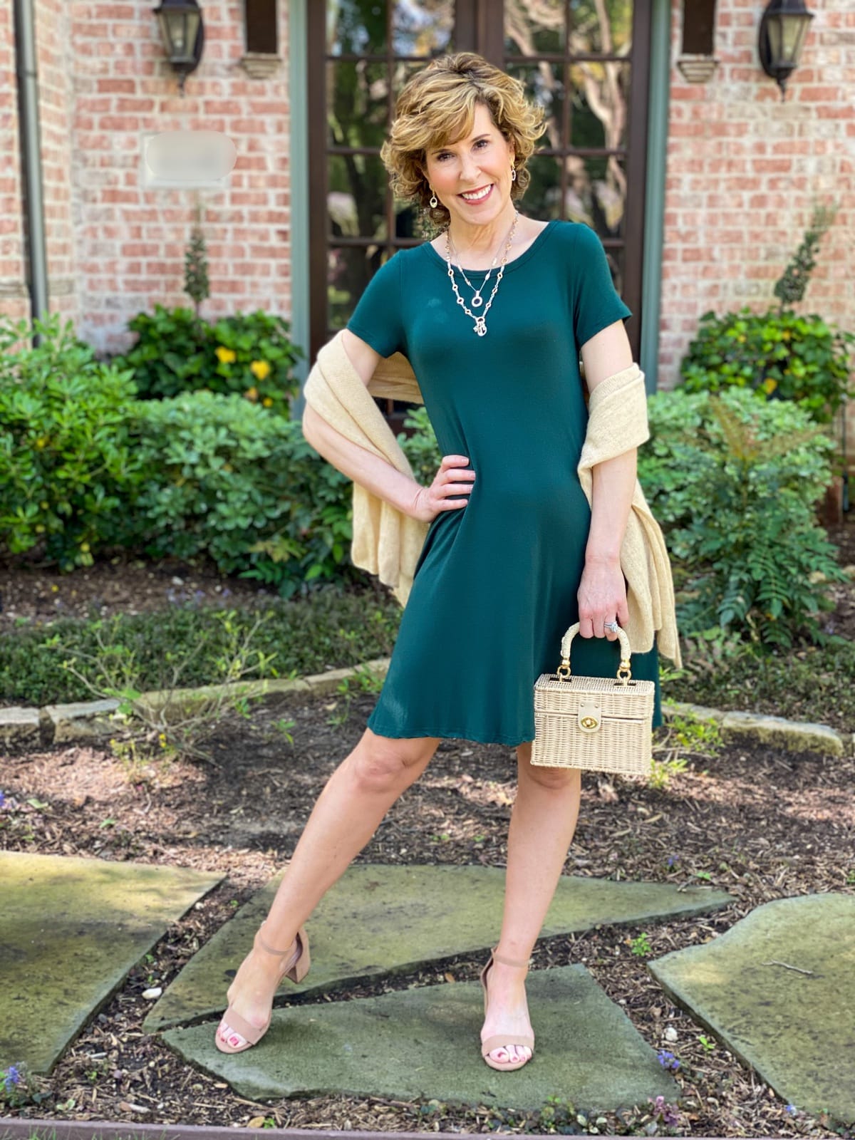 woman in green dress with gold wrap