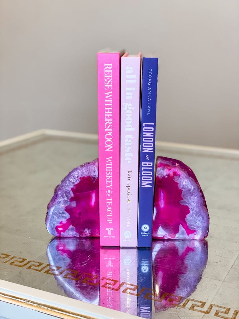 pink coffee table books and gemstone bookends