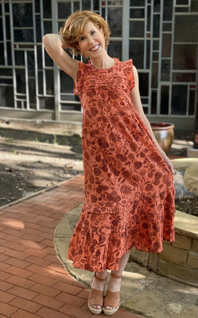 woman standing in a yard wearing Floral Print Ruffle Sleeveless Dress - Universal Thread™