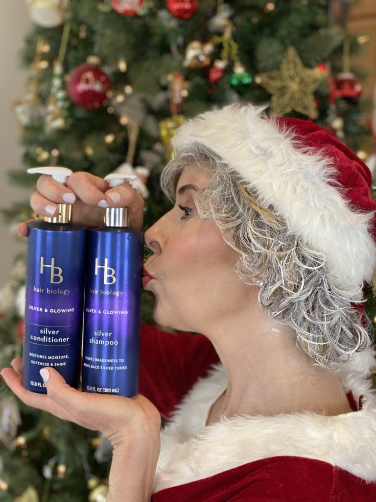 mrs claus kissing hair biology's silver and glowing shampoo and conditioner