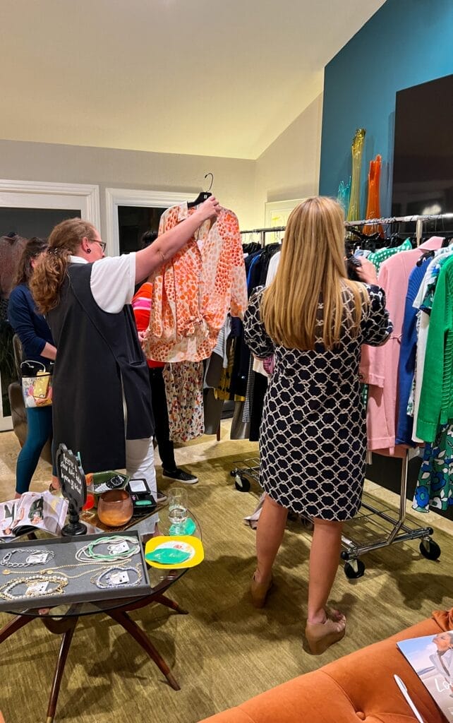 a cabi fashion experice guests browsing current styles