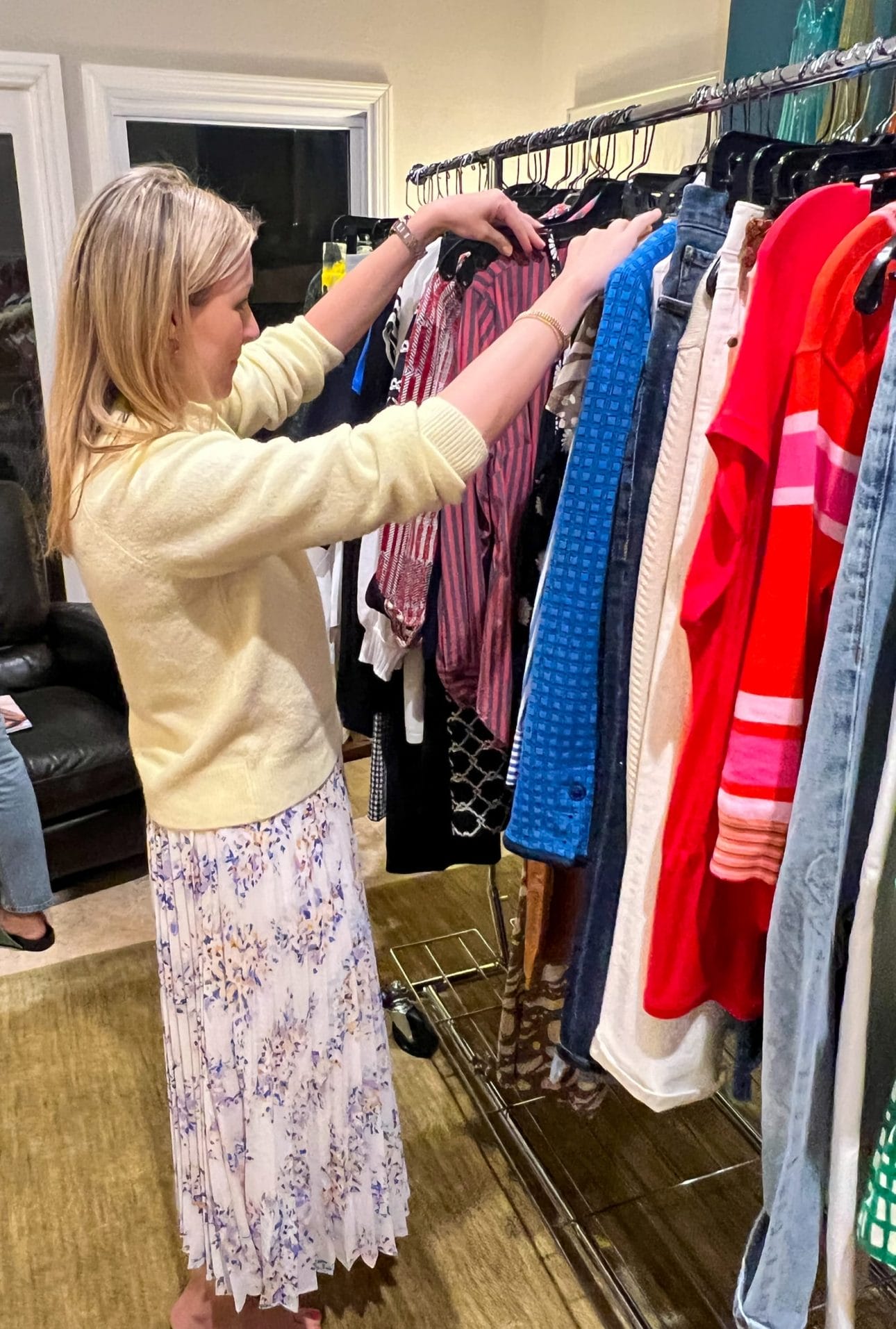 a cabi fashion experience guest browsing current styles