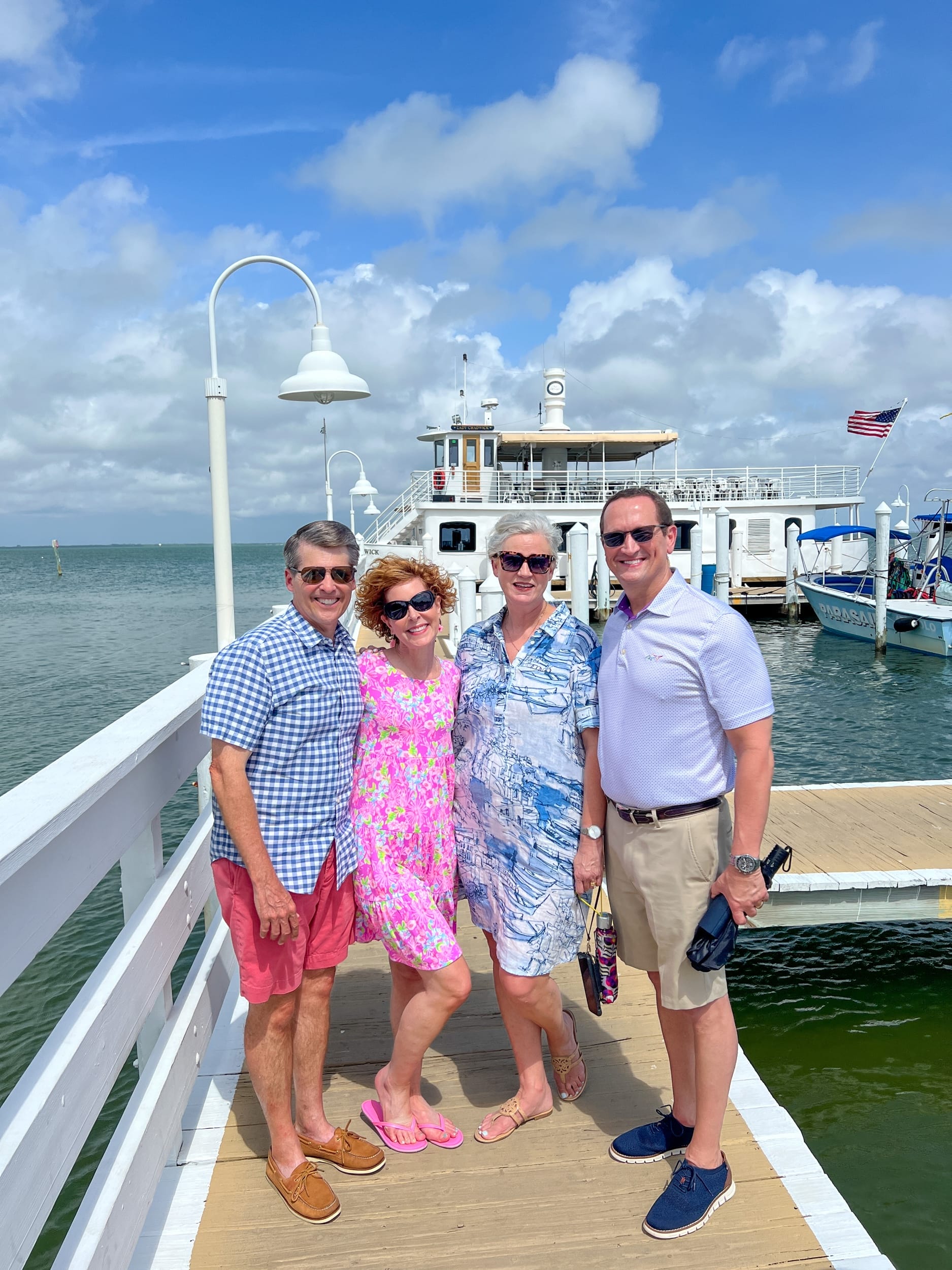 two couples standing on a dock on captiva island