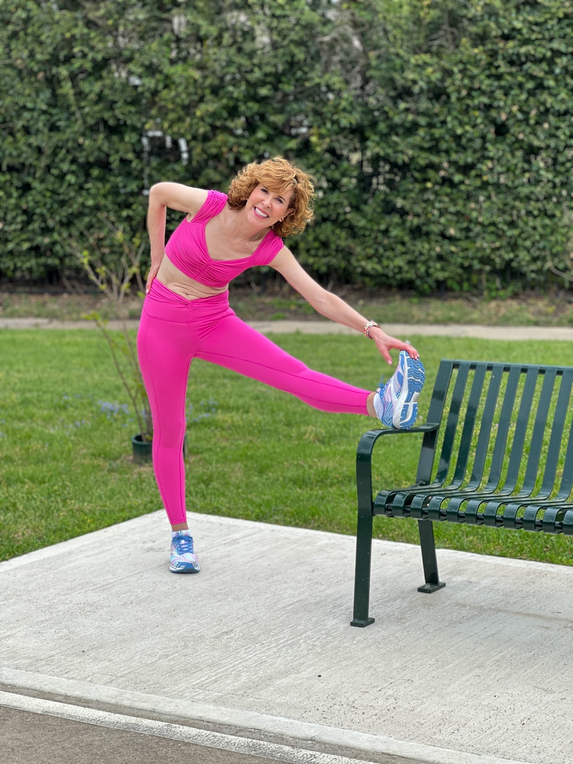 woman over 50 stretching before walking for fitness