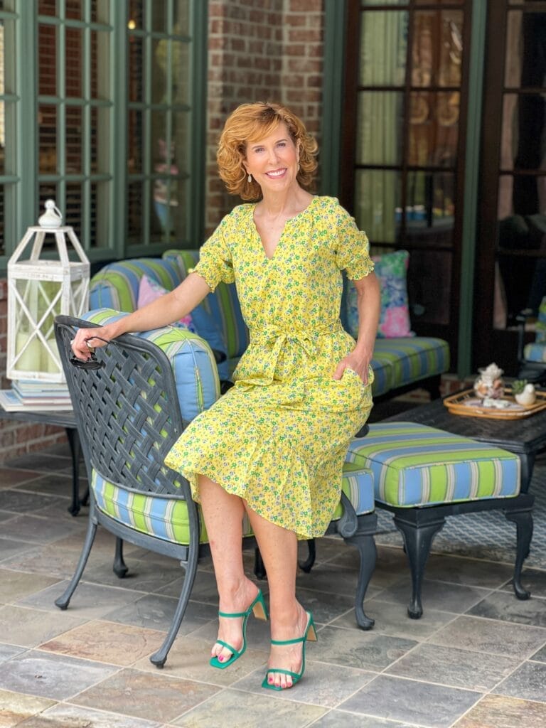 woman wearing Floral Smocked Voile Fit & Flare Dress from talbots sharing tips for preparing for the emtpy nest