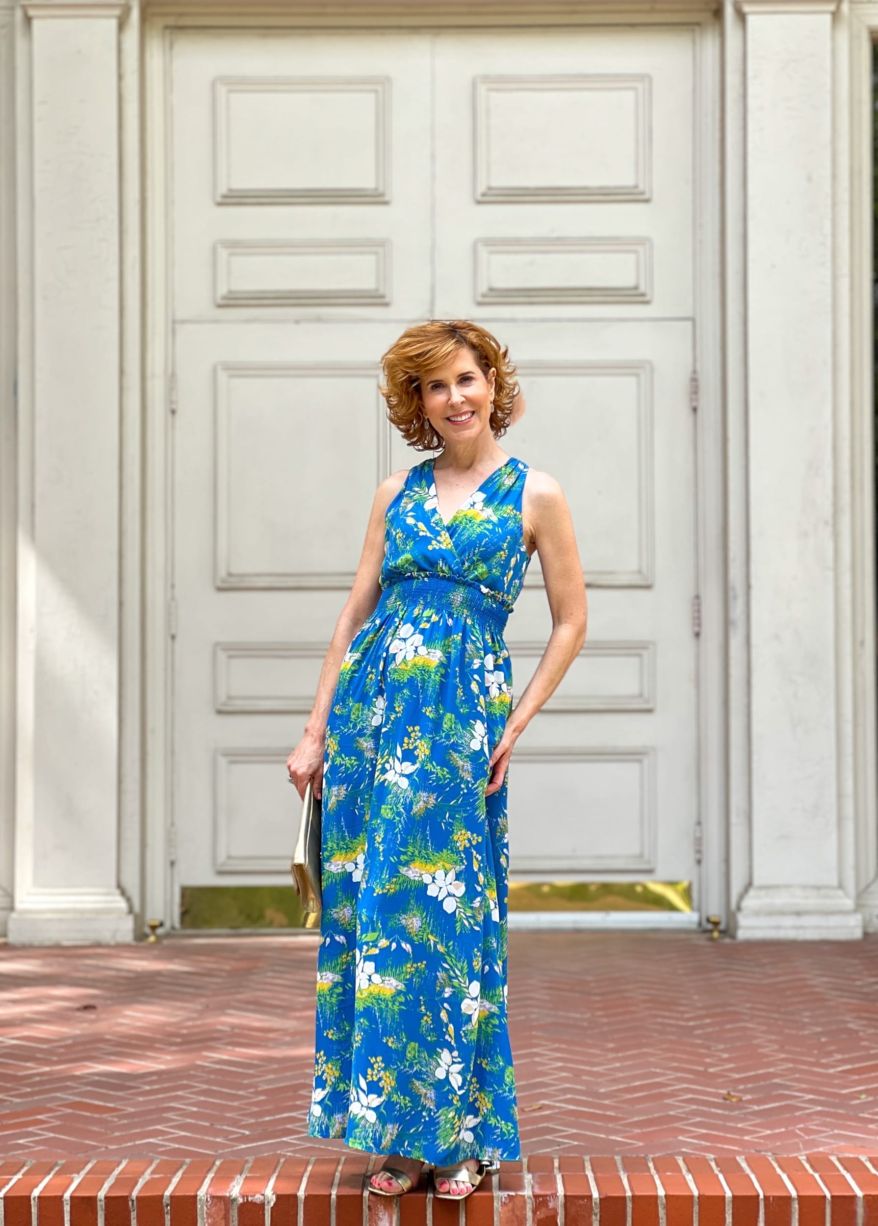 woman over 50 standing in front of church doors wearing Halogen® Wrap Front Halter Dress from Nordstrom Made Brands