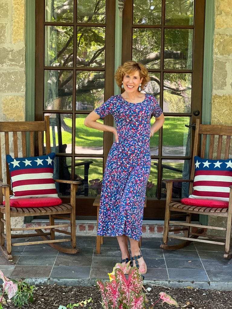 woman standing on front porch on july 4th