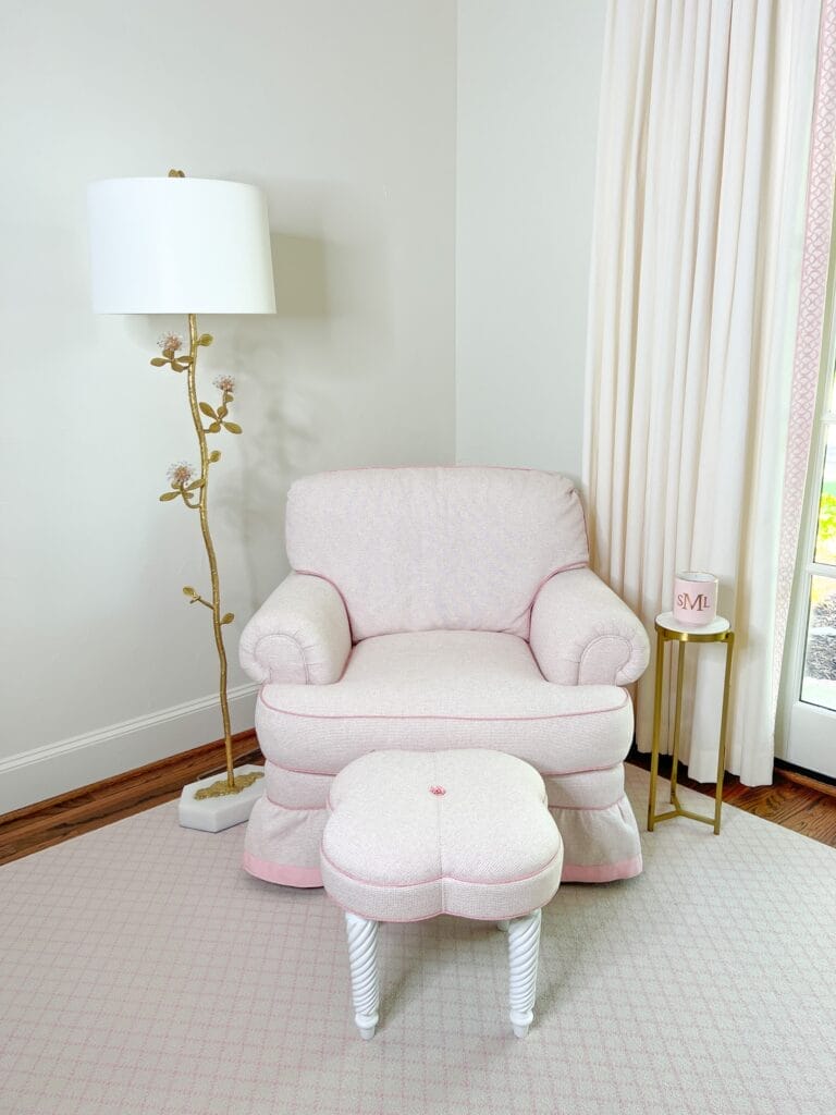 pale pink club chair next to decorative lamp in corner of room