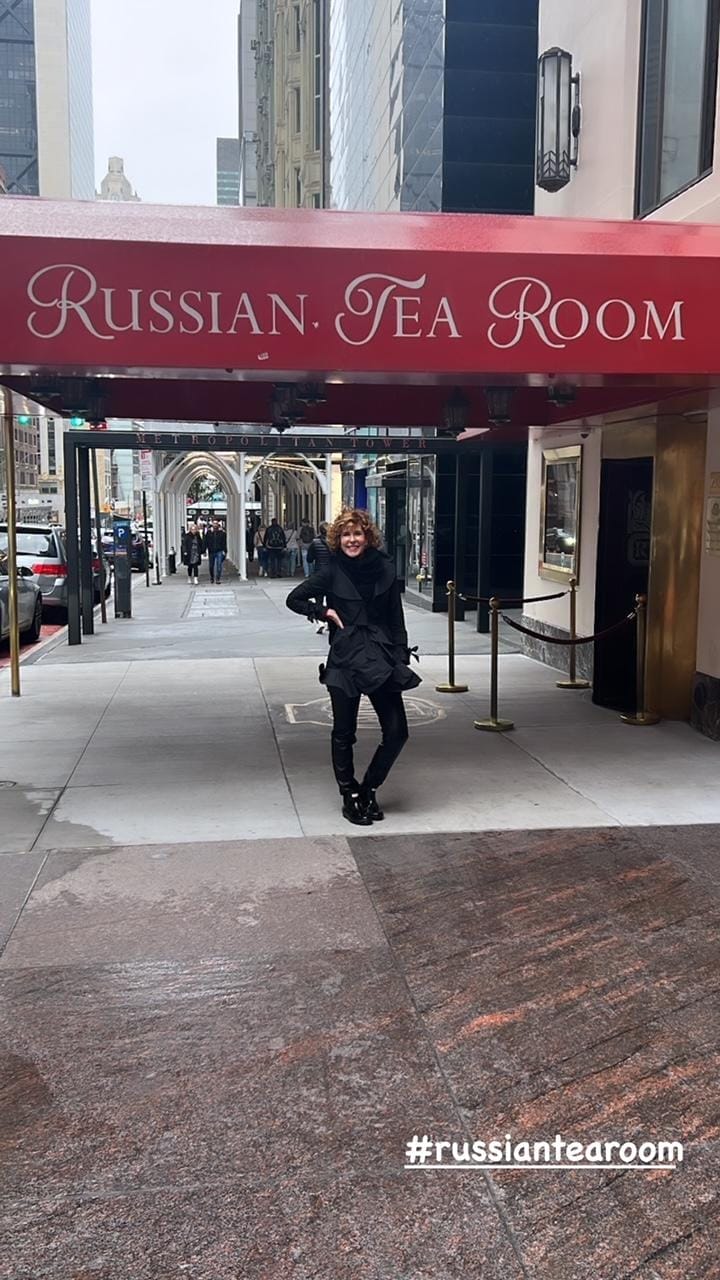 woman standing in front of the Russian Tea room restaurant in NYC