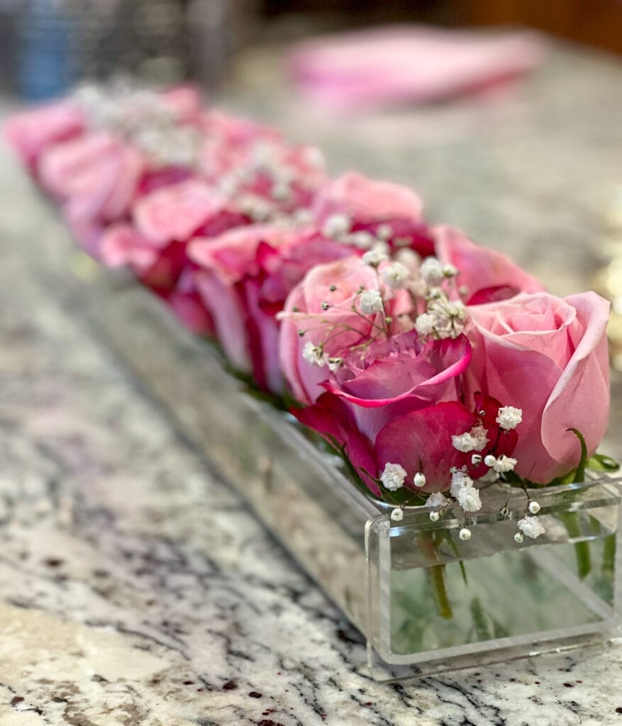 pink roses in acrylic centerpiece