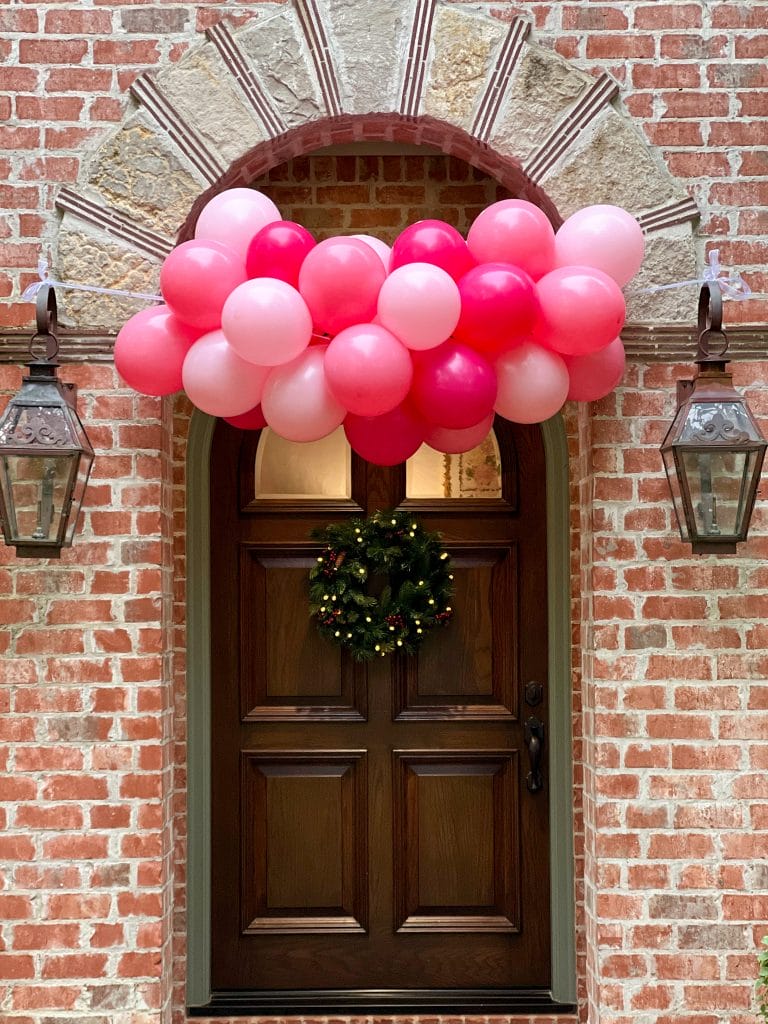 pink balloons over front door