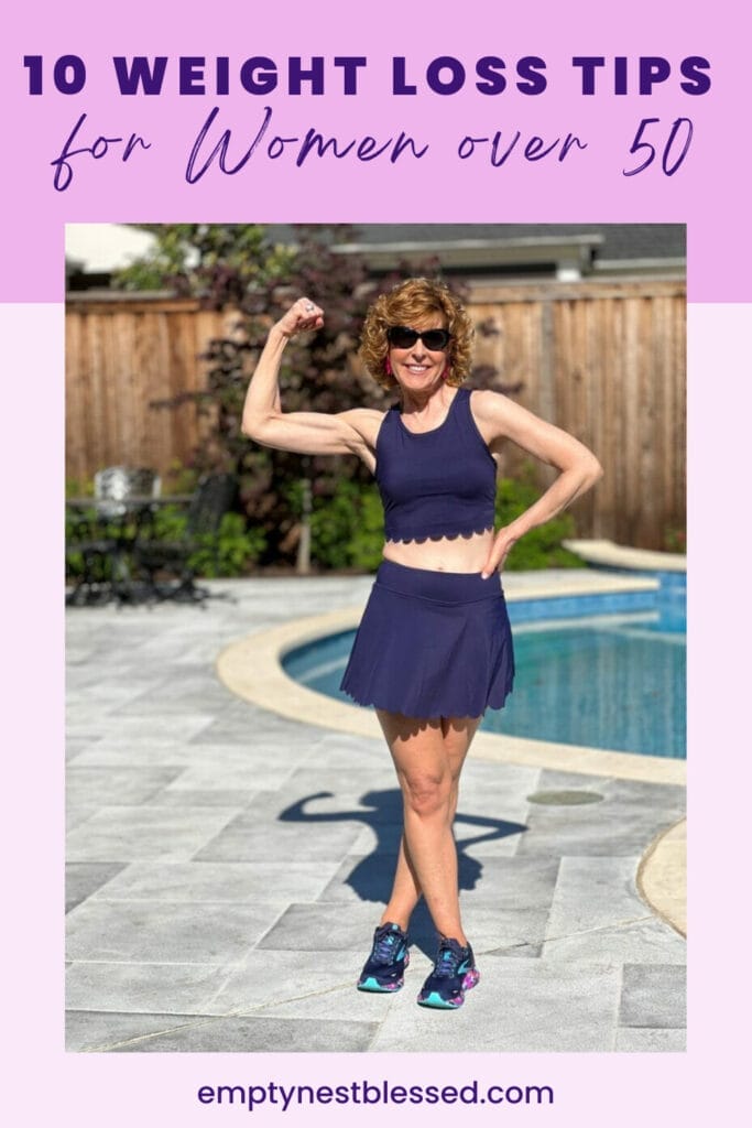 Picture of women in navy blue workout outfit standing by pool
