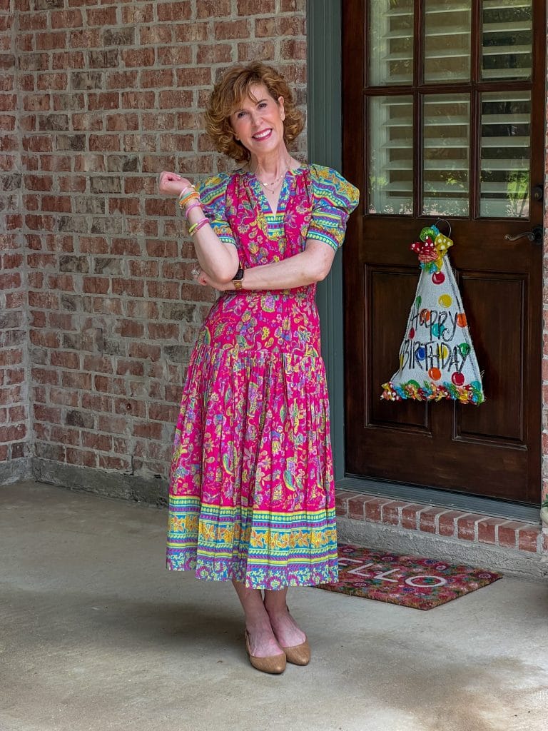 woman standing on porch wearing avara dress