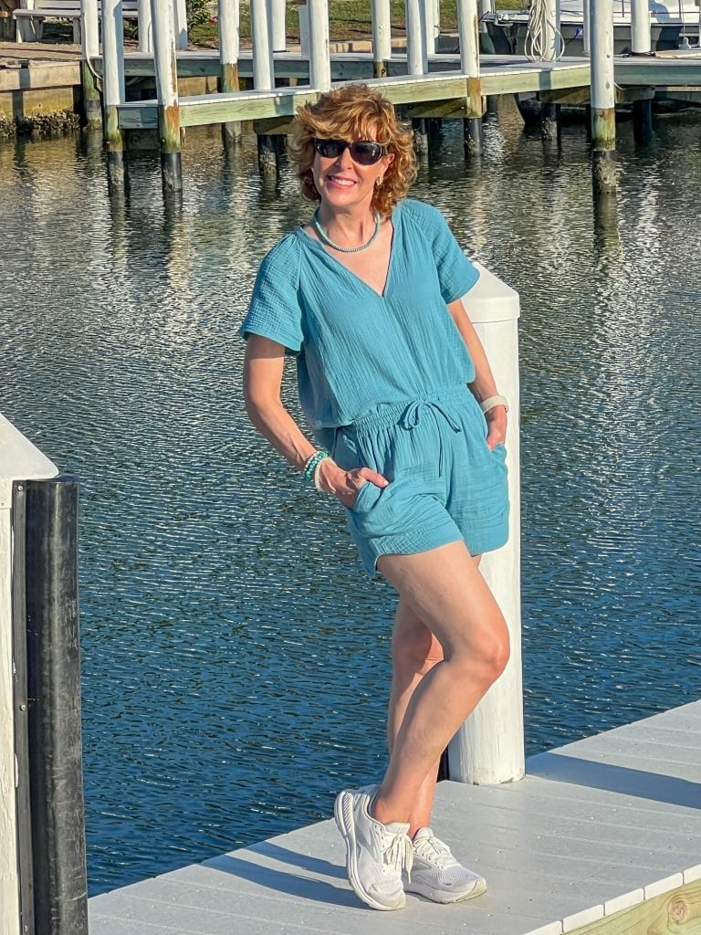 woman standing on a dock wearing a gauze short set from haven