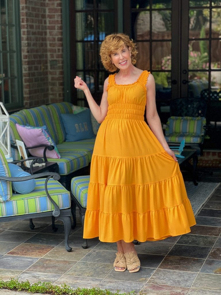 woman over 50 standing on back porch posing and wearing Antonio Melani Bentley Square Neck Pebble Crepe A-Line dress