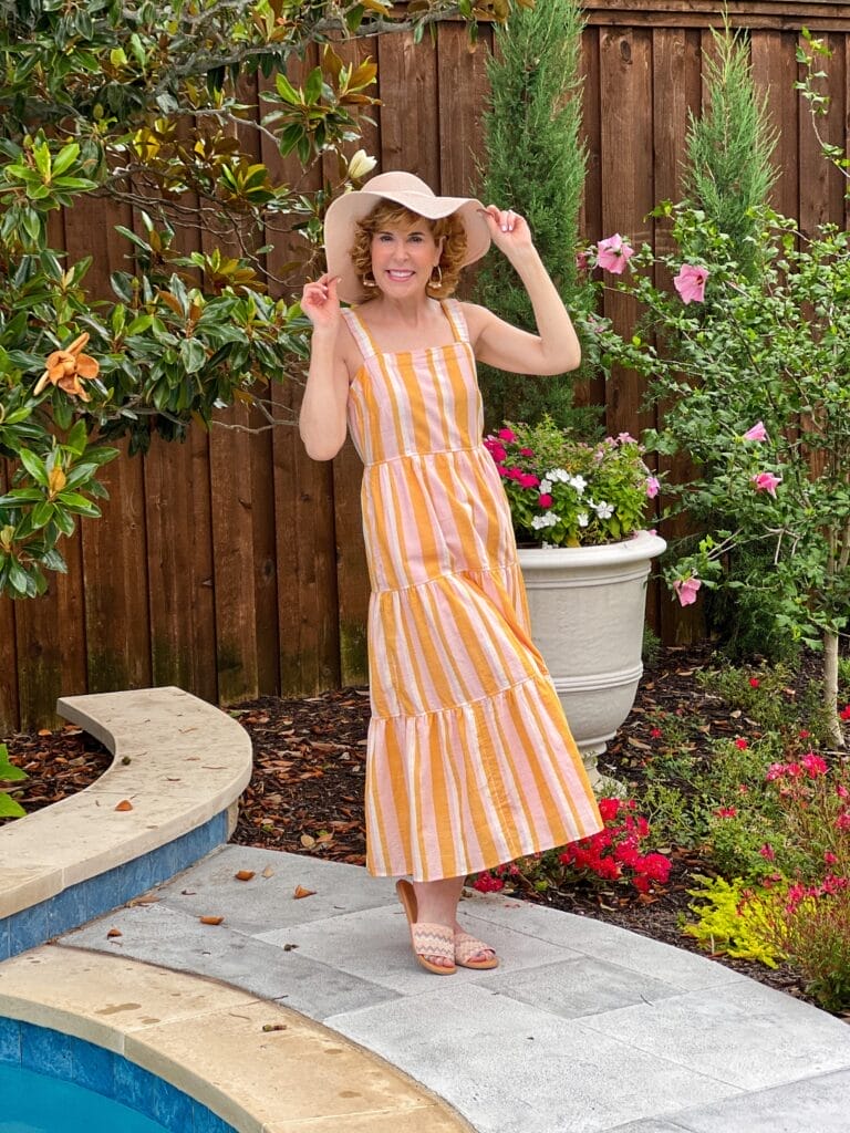 woman wearing Free Assembly Women's Sleeveless Square Neck Maxi standing in a garden wearing a hat