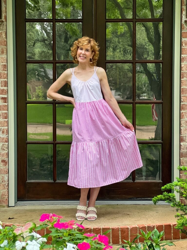 woman over 50 wearing walmart free assembly midi dress in pink
