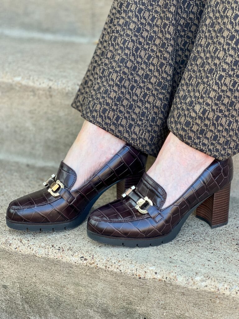 woman's feet on stairs wearing easy spirit mirror loafers