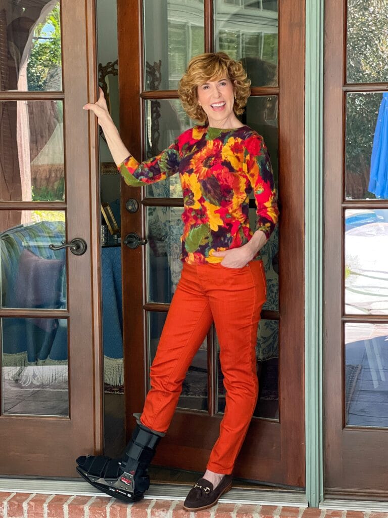 woman over 50 standing by door in fall outfit