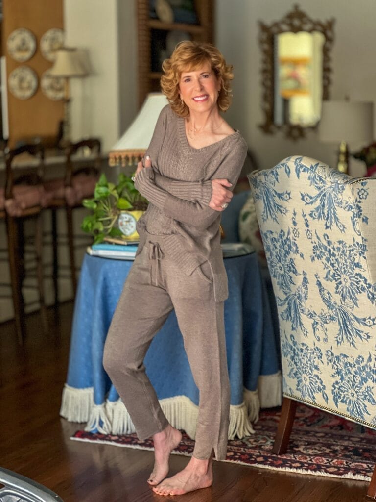 woman standing in living room wearing brown loungewear set from soma