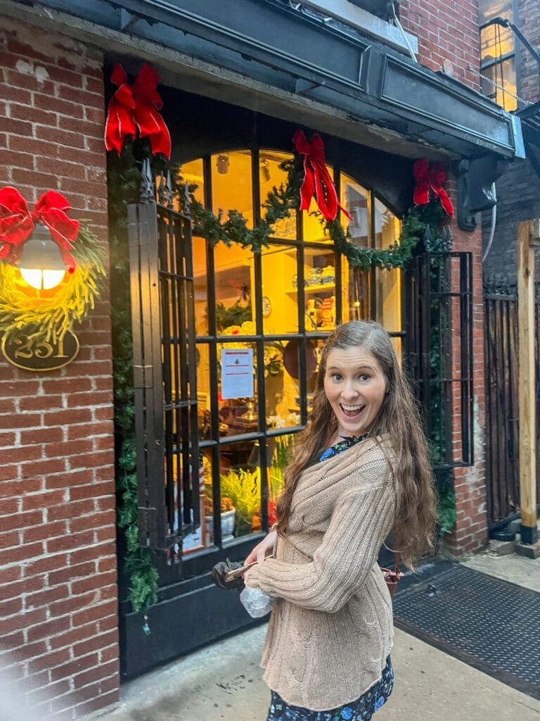 girl standing in front of king's carriage house tea room in nyc