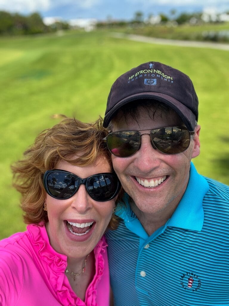 couple golfing together