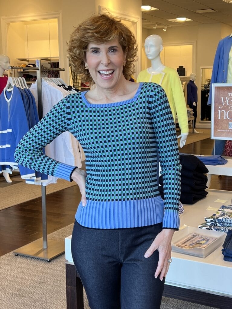 woman wearing blue square neck sweater in talbots store