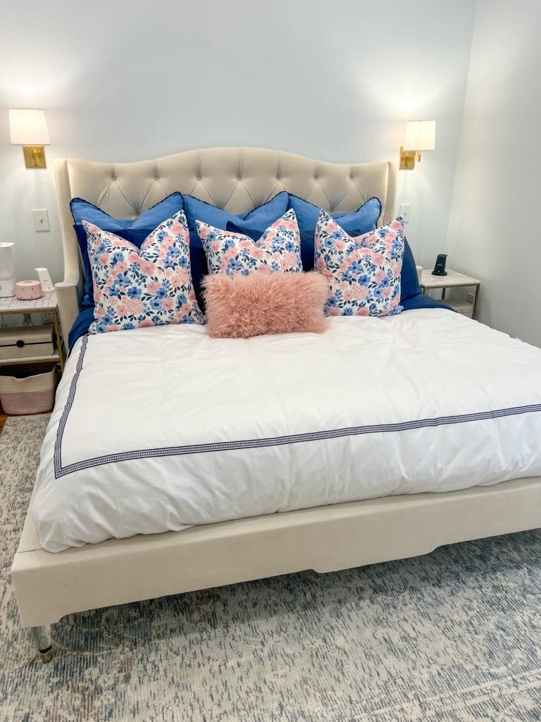king size bed in bedroom with bedside tables beside