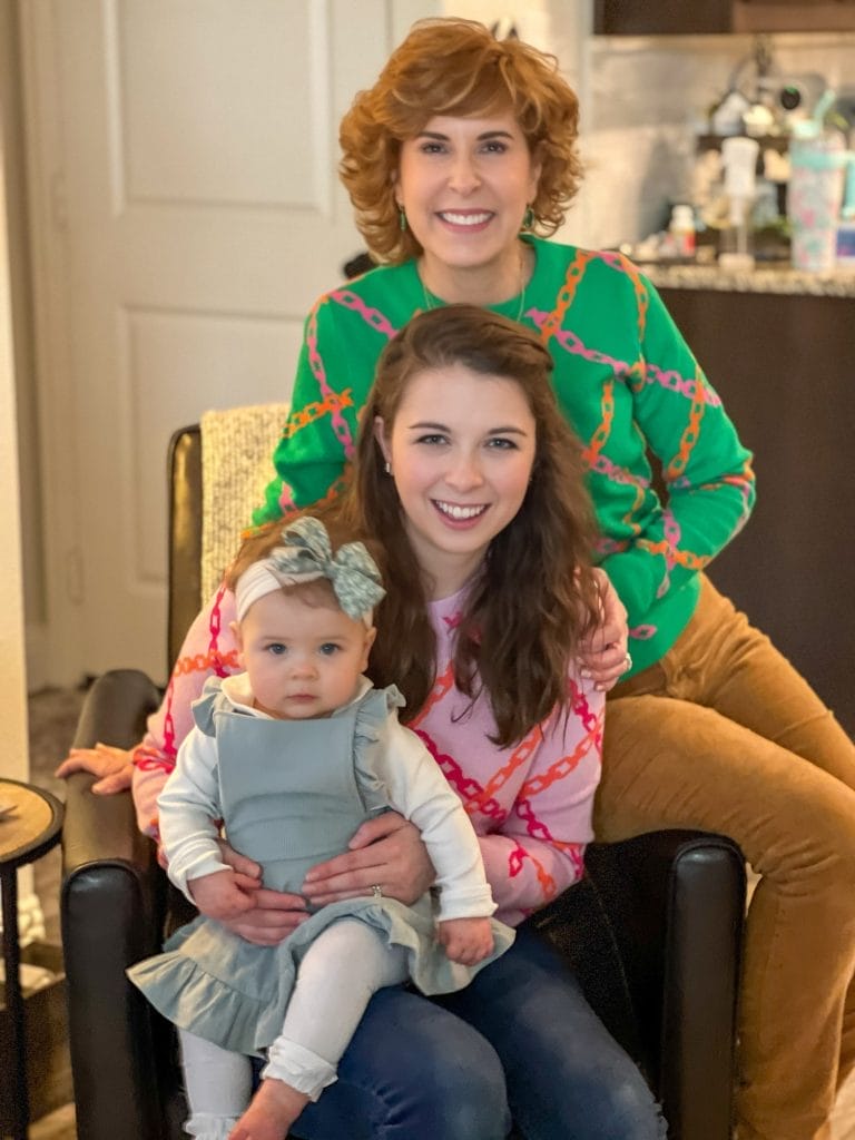 three generations of women sitting on a chair