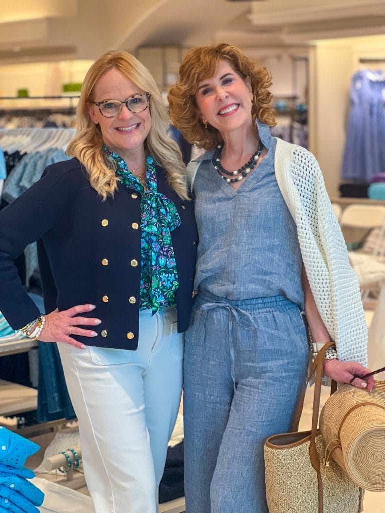 two women over 50 posing in talbots store