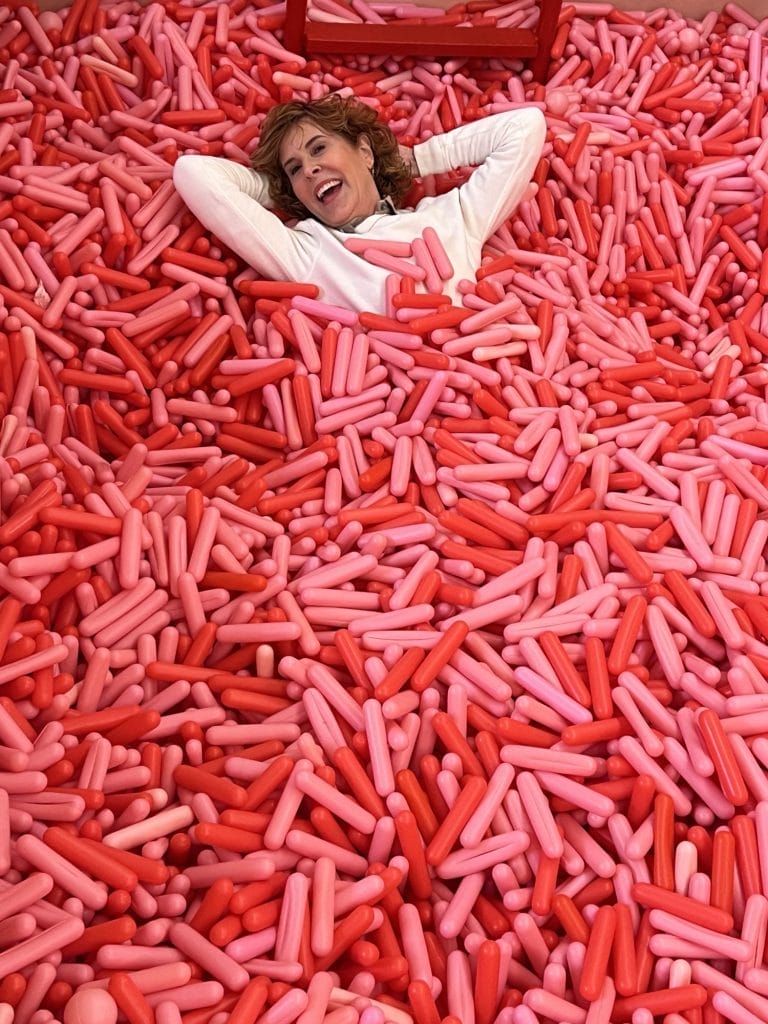 woman in the pool of sprinkles at museum of ice cream nyc