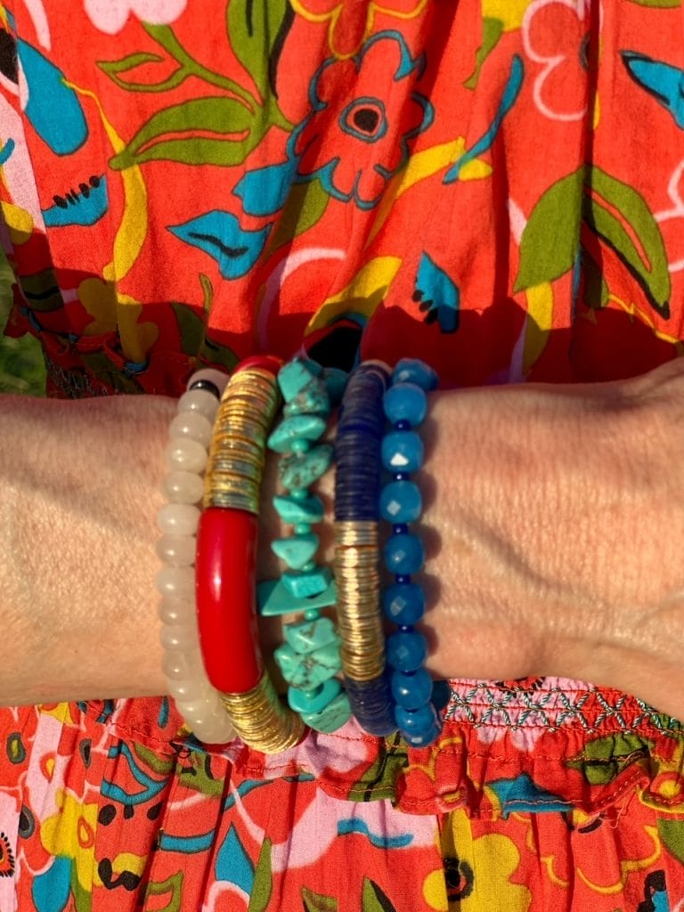 picture of a woman's wrist with a multicolored bracelet