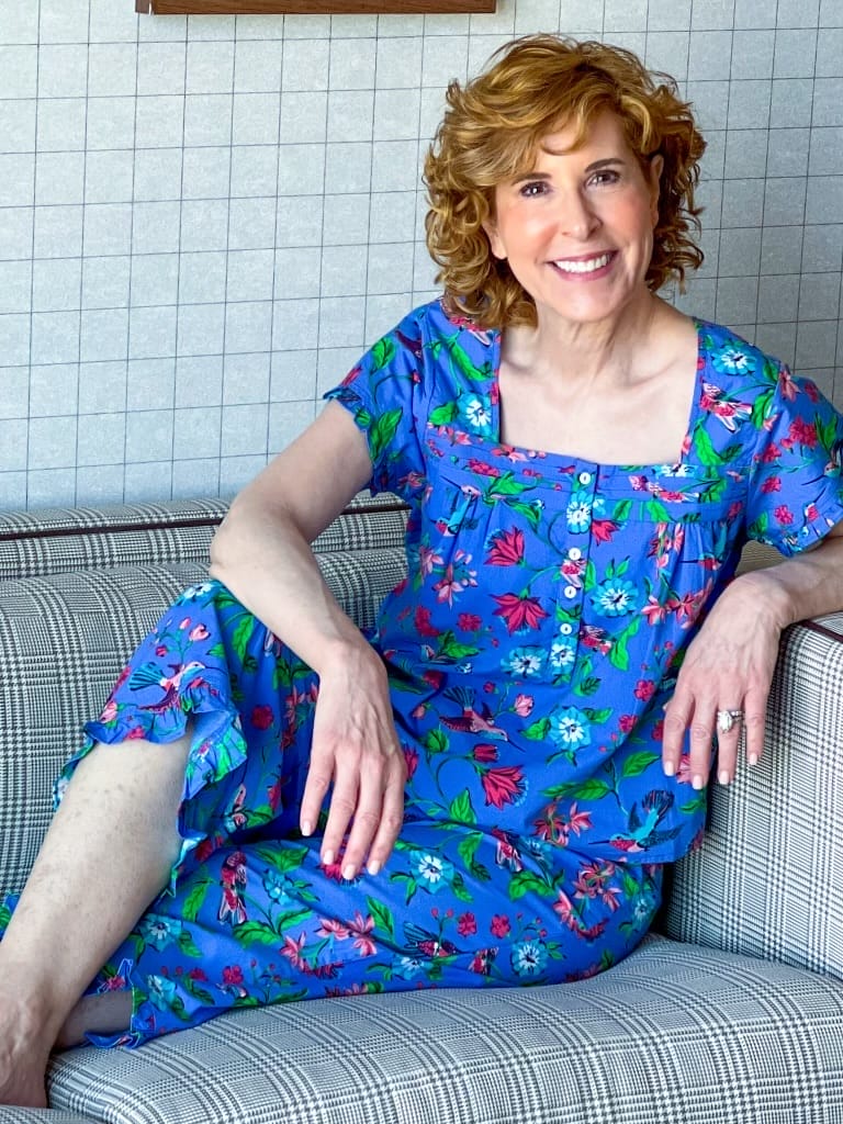 woman sitting on couch in printfresh pajamas