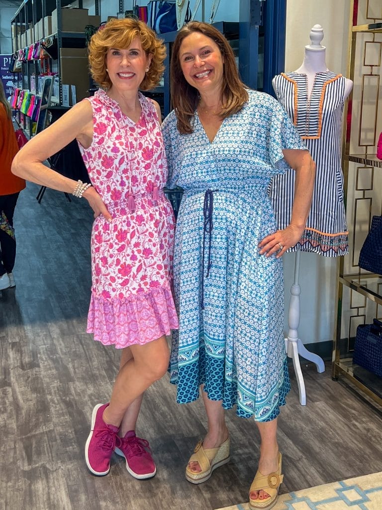 two midlife women posing in a warehouse and wearing cabana life sun safe clothing
