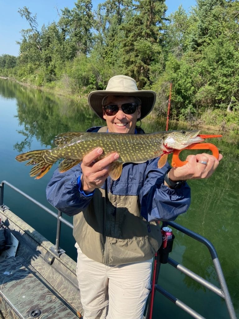 man holding fish he caught