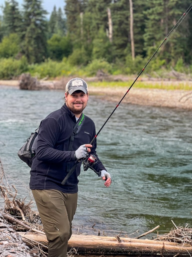 man fishing in the swan river in montana