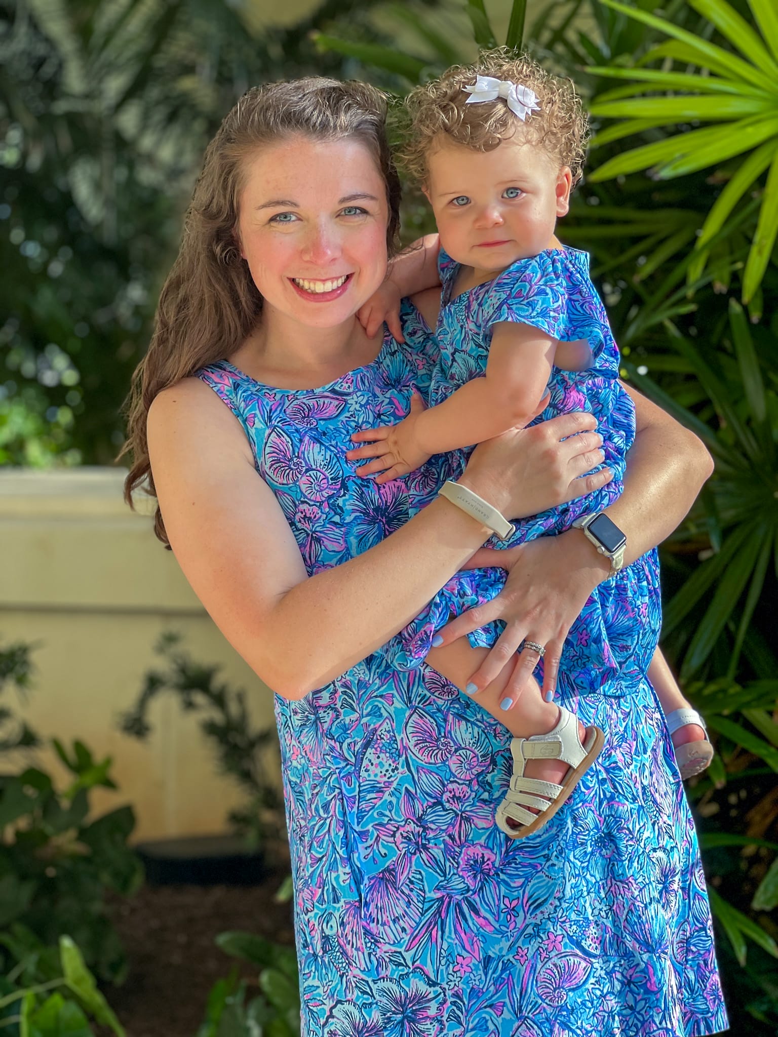 young mom and baby wearing matching dresses at baha mar