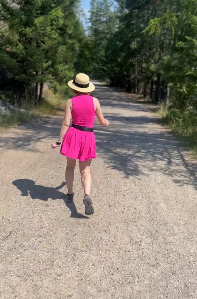 woman in pink workout dress from behind