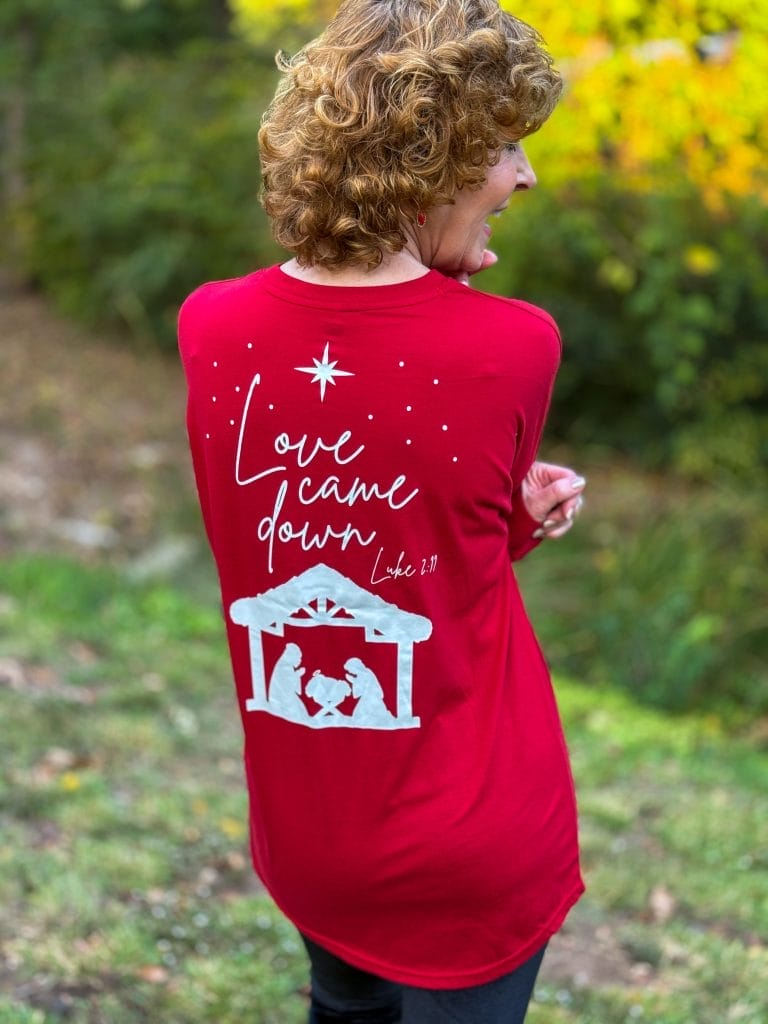 woman standing to the back wearing love came down long sleeve red tee from marleylilly